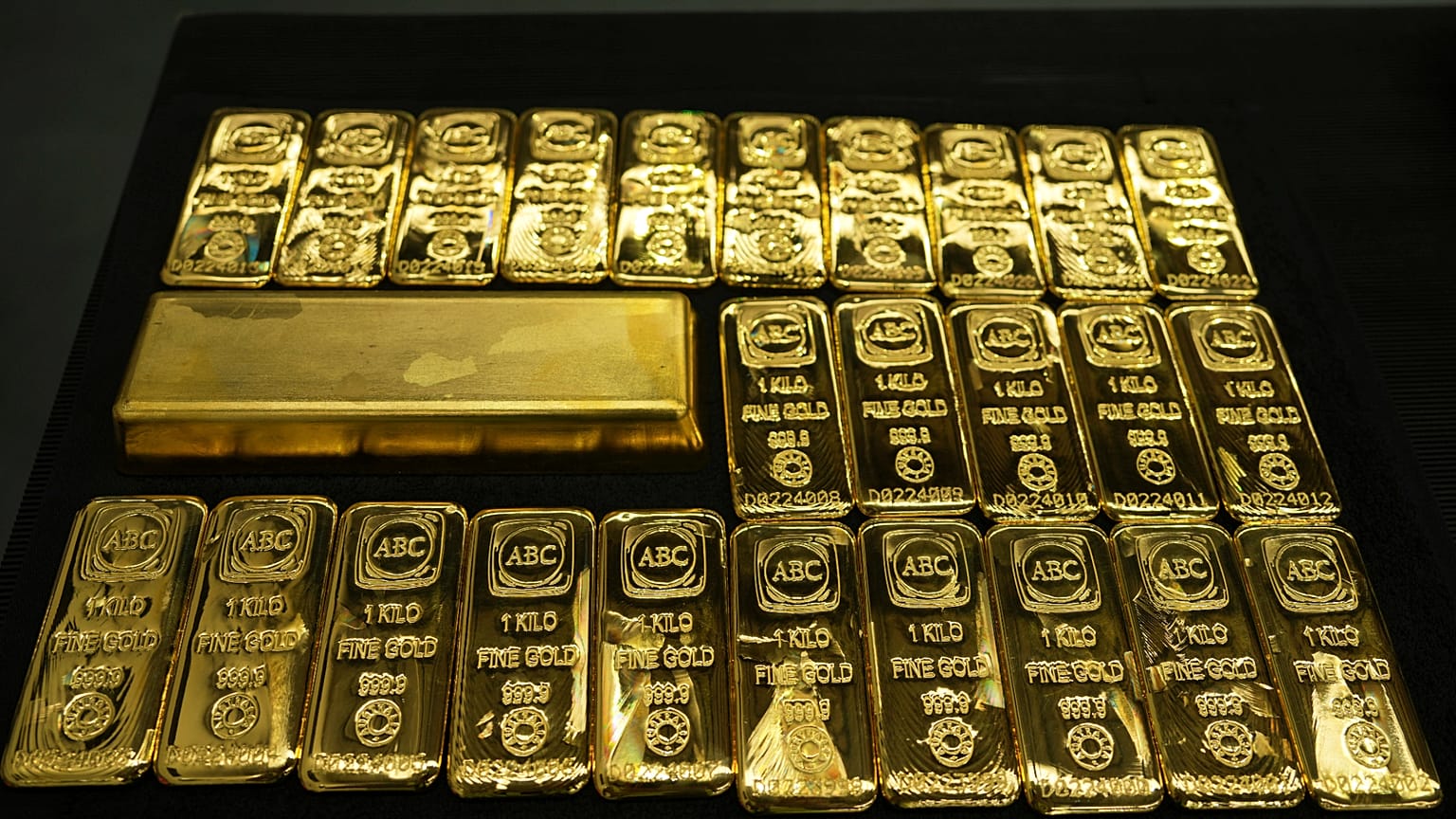 A 12.441 kg gold bar sits amongst one kilogram gold cast bars with 99.99% purity ready for sale at the ABC Refinery in Sydney, Australia, Wednesday, April 30, 2025.