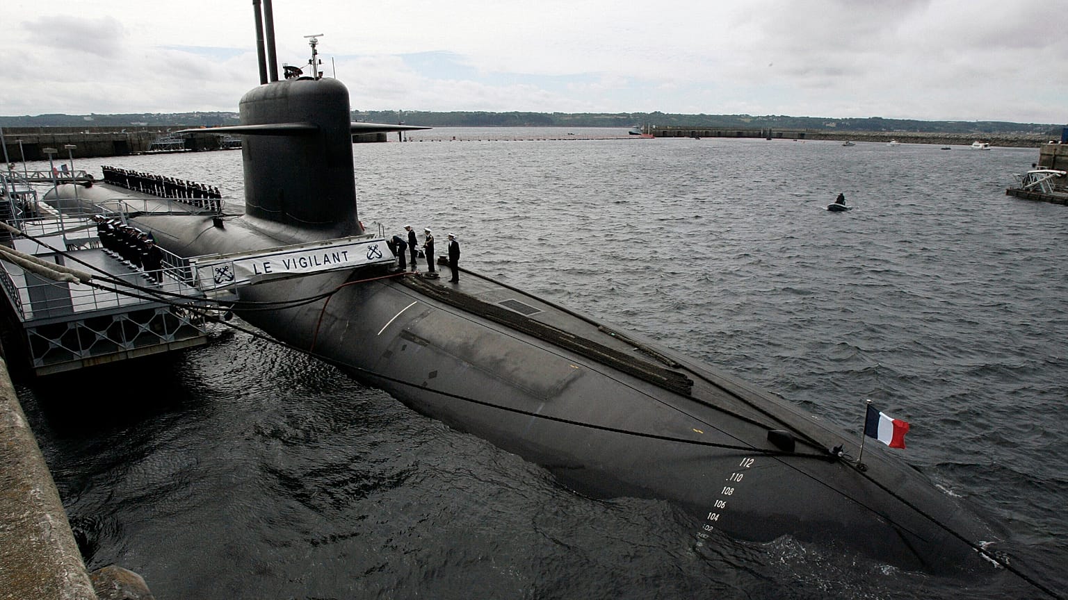 In this July 13, 2007 file photo, French Marine officers wait atop "Le Vigilant" nuclear submarine at L'Ile Longue military base, near Brest, Brittany. 