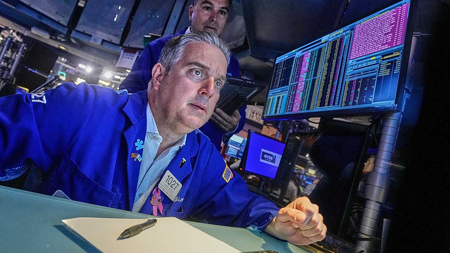 Traders James Bodner, foreground, and Chris Lagana work on the floor of the New York Stock Exchange. 13 October 2025