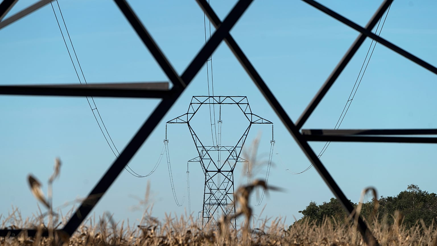 Electricity poles are seen in the countryside outside Lyon, central France, Monday, Sept. 12, 2022.