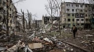 A soldier walks through the ruins of the town of Kostyantynivka, in the Donetsk region, Ukraine. Saturday Dec. 20, 2025