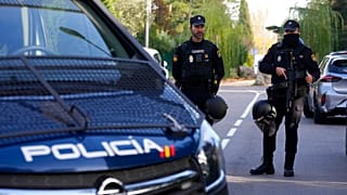 FILE: Police officers stand guard as they cordon off the area in Madrid, 30 November 2022