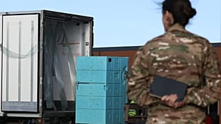 A soldier watches vaccines loaded onto a truck as France launches a campaign to vaccinate 750,000 cattle against lumpy skin disease in southwest France, Dec. 18, 2025.