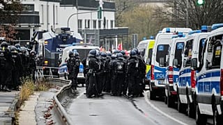 German police officers stand together during a demonstration in Giessen, 29 November, 2025