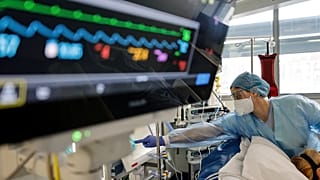 FILE: A nurse cares for a COVID-19 patient in the intensive care unit of the Strasbourg University Hospital, 13 January, 2022