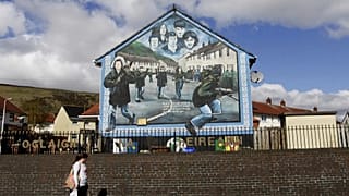 FILE: An Irish Republican Army mural in West Belfast, Northern Ireland, Wednesday, April, 4, 2012.