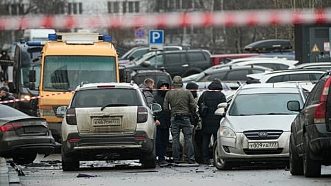 Investigators work the scene where Lt. Gen. Fanil Sarvarov, head of the Operational Training Directorate of the Russian Armed Forces General Staff, was killed by an explosive 