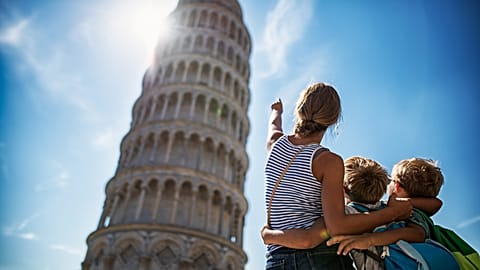 Tourists kids sightseeing Pisa, Italy